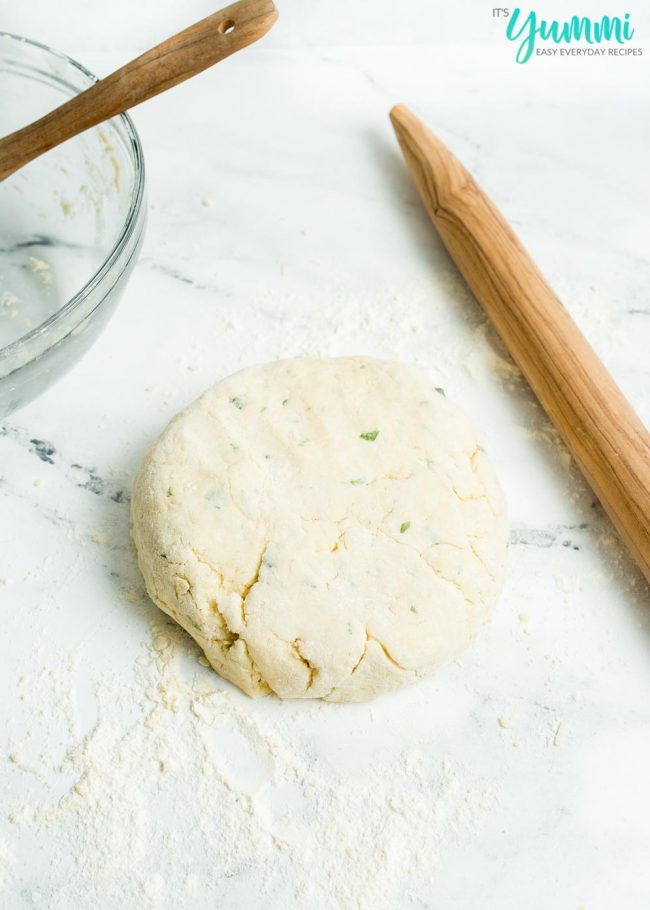 Cheddar Bay Biscuit Dough Ball on counter with rolling pin ready to be rolled out