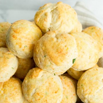 Close-up of Baked Cheddar Bay Biscuits in wooden basket