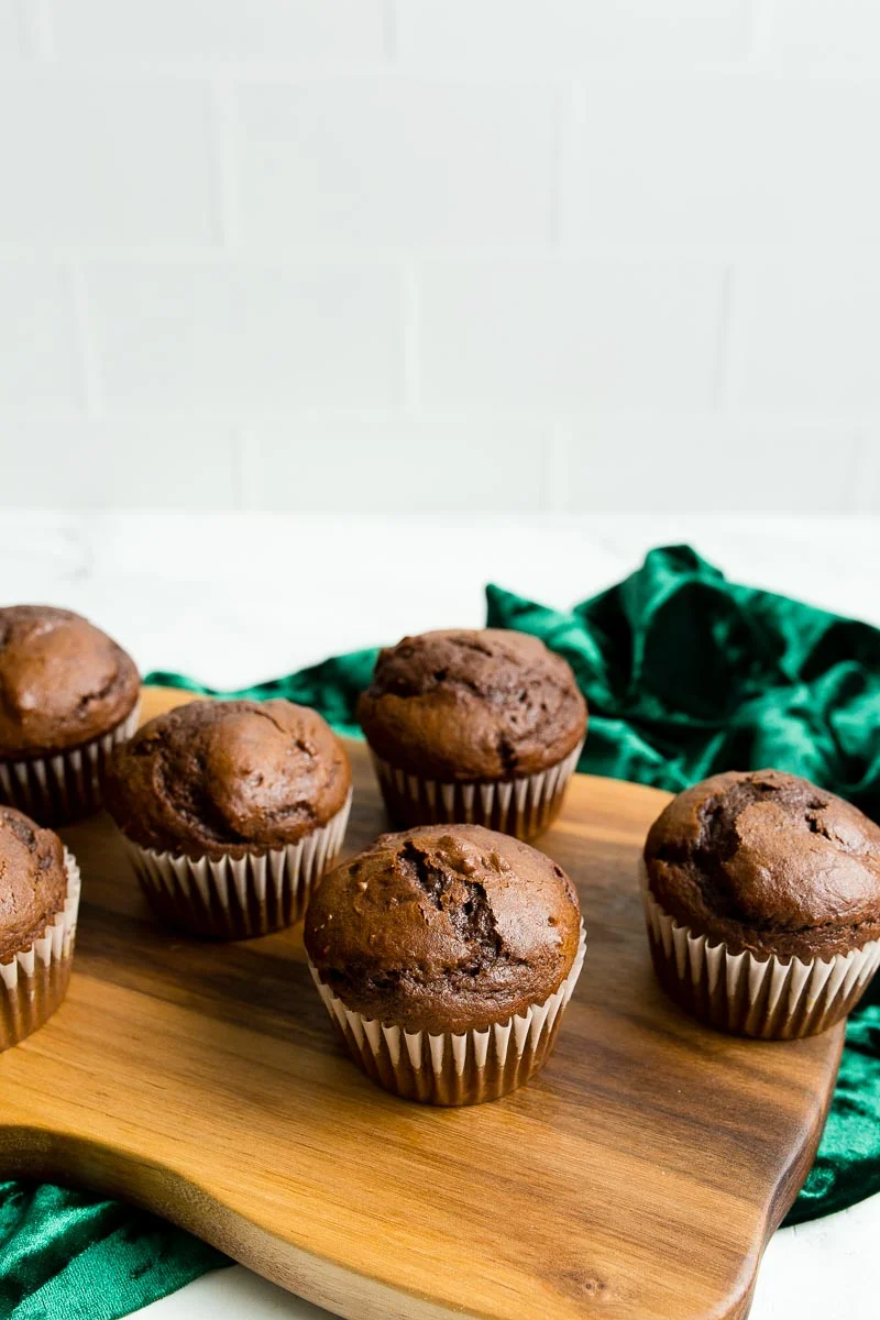 Chocolate Pumpkin Cupcakes on walnut cutting board