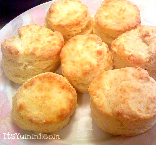 Buttermilk Cornmeal Biscuits - Warm, fluffy biscuits with a cornmeal and buttermilk base make them the perfect choice for breakfast sandwiches, biscuits and gravy, or a snack with honey butter spread on top! Get the recipe from itsyummi.com