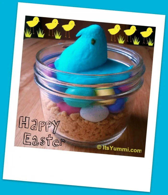 Get 10 recipes using Easter marshmallow Peeps. PLUS directions for super cute DIY Easter table decor... a Peeps mother-to-be centerpiece or place holders. #easter #DIY #kidscrafts #peeps #desserts #holiday Blue Easter Marshmallow Peeps Centerpiece - marshmallow chick in a Canning Jar Sitting on crushed graham crackers and Malted Milk ball eggs