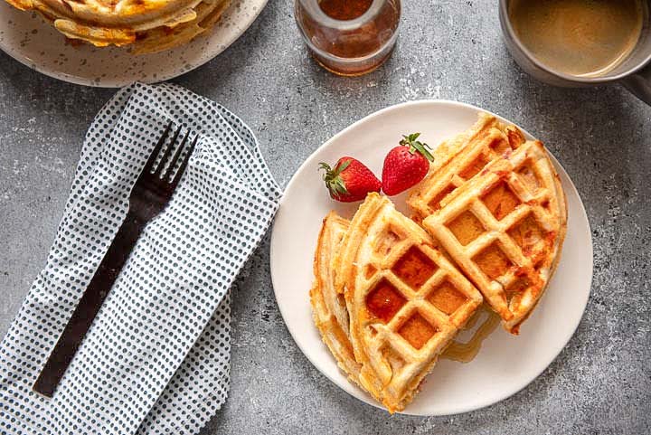 plate of savory waffles with syrup