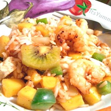 Spicy grilled shrimp is paired with sweet tropical fruit and aromatic Jasmine rice to make a refreshing salad that can be eaten warm or cold. Get the recipe from ItsYummi.com