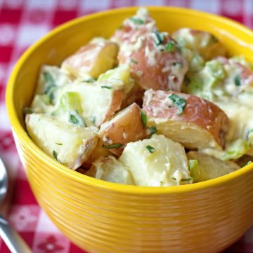 bowl of warm potato salad with fresh tarragon