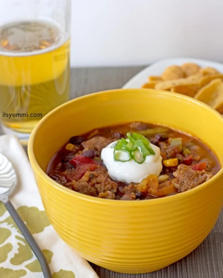 Sweet and Spicy Bratwurst Chili Recipe - Just 5 cans and 15 minutes is all it takes to make this delicious "dump and go" chili recipe. You can make it in a slow cooker, too!