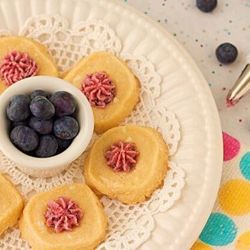 I'm loving this cookie recipe! White Chocolate Shortbread Cookies with Blueberry Buttercream Icing from ItsYummi.com