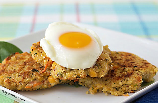 3 Quinoa Chickpea Patties sitting on a square white plate, topped with a poached egg.