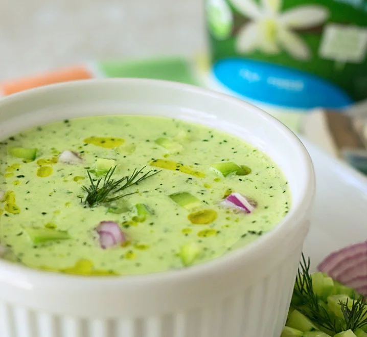 bowl of cold cucumber soup garnished with fresh dill