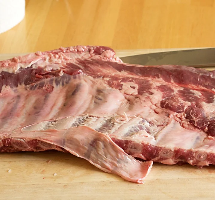 Removing silver skin from the underside of pork spare ribs
