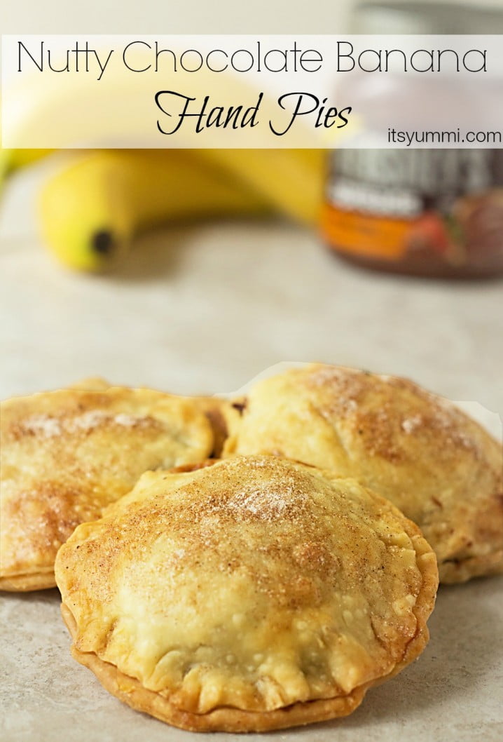 Nutty Banana Chocolate Hand Pies - A sweet treat! Flaky pastry is full of chocolate hazelnut spread, bananas, and chopped nuts. Get the recipe from @itsyummi
