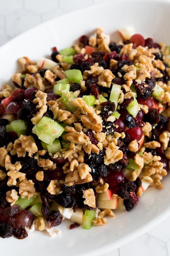 A close up of the extra ingredients that go into a chicken waldorf salad