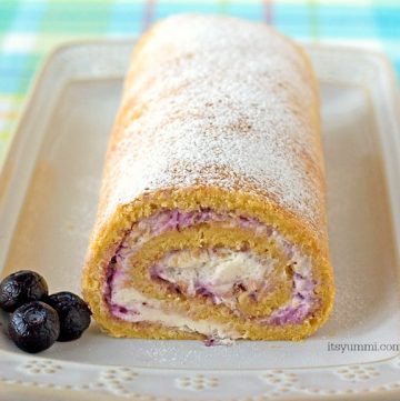 Blueberries and Cream Cake Roll - This easy cake recipe is filled with fresh blueberry preserves and whipped cream. Such an easy dessert recipe! | ItsYummi.com