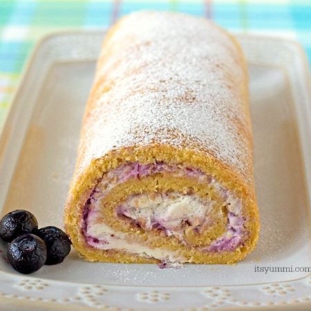 Blueberries and Cream Cake Roll - This easy cake recipe is filled with fresh blueberry preserves and whipped cream. Such an easy dessert recipe! | ItsYummi.com