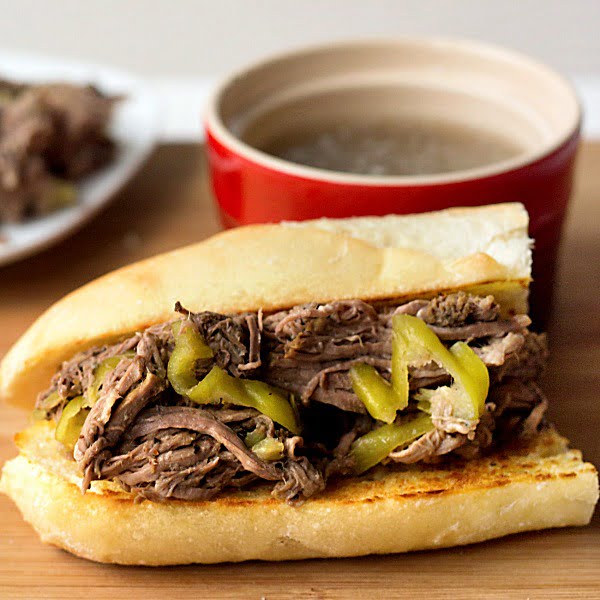 Easy slow cooker Italian beef recipe - this is the best one pot meal I've ever eaten and it's perfect game day food!