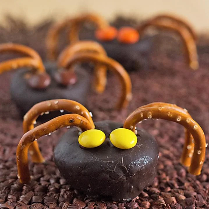 15 Fun Food Creations for Halloween, including these Mini Spider Doughnuts - find them all on ItsYummi.com