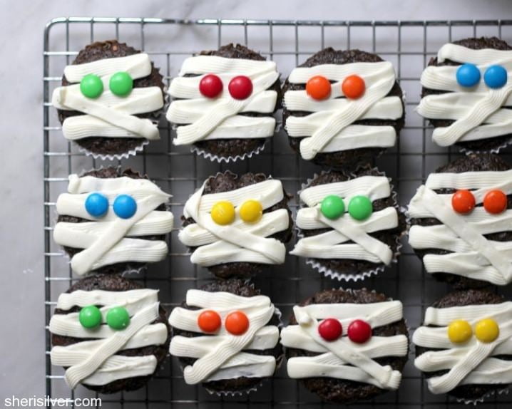 15 Fun Food Creations for Halloween, including Mummy Cupcakes from Donuts, Dresses, & Desserts - find them all on ItsYummi.com