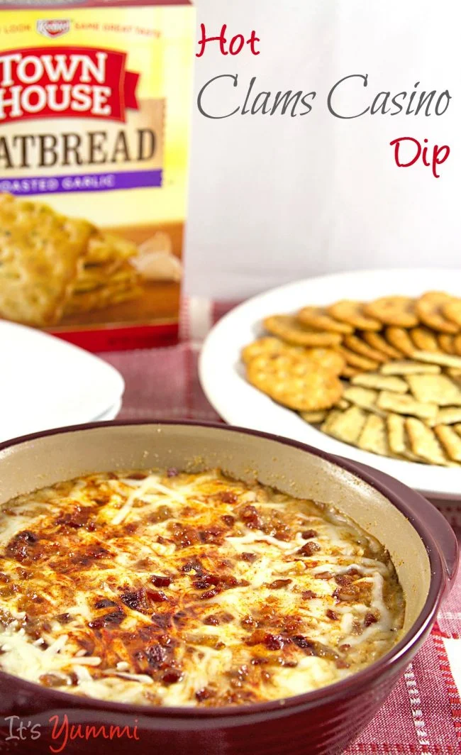 Clams casino dip is one of the best appetizers, especially for holiday entertaining. This dip recipe is a take on baked clams. #clamdip #clamscasino #bestappetizers baking dish of hot clam dip with bacon