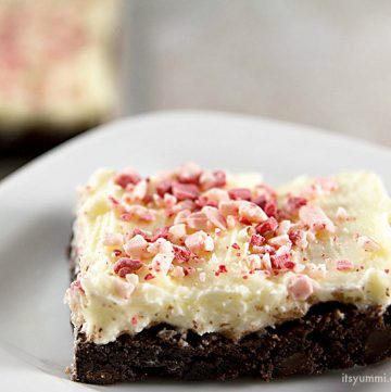 chocolate fudge brownies topped with peppermint frosting and crush candy canes