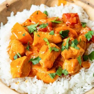 Chicken Paprikash served over a bowl of white rice