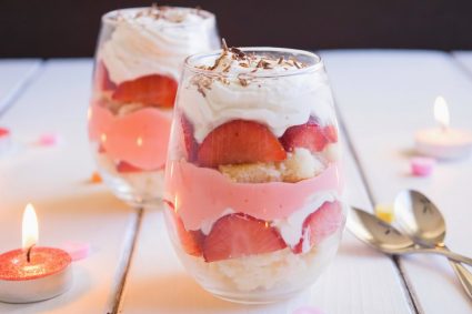 Trifle for two is the perfect Valentine's Day dessert! Layers of orange flavored sponge cake, strawberries, traditional English custard, and orange infused whipped cream give this English custard trifle for two it's delicious flavor! | ItsYummi.com