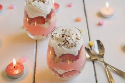 Trifle for two is the perfect Valentine's Day dessert! Layers of orange flavored sponge cake, strawberries, traditional English custard, and orange infused whipped cream give this English custard trifle for two it's delicious flavor! | ItsYummi.com