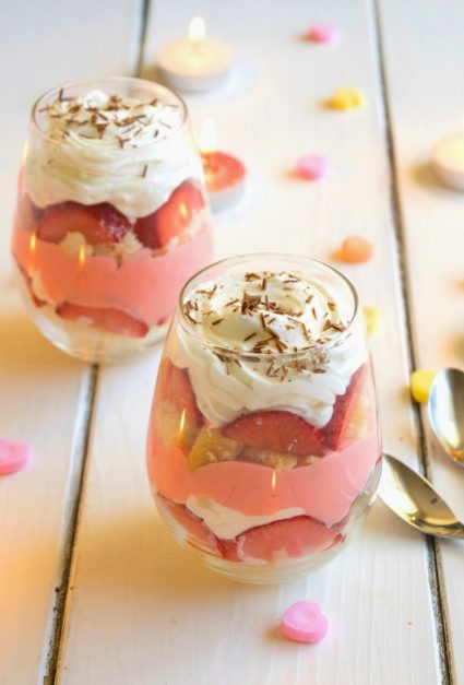 Layers of orange flavored sponge cake, strawberries, traditional English custard, and orange infused whipped cream give this Valentine's Day English custard trifle for two it's delicious flavor! | ItsYummi.com
