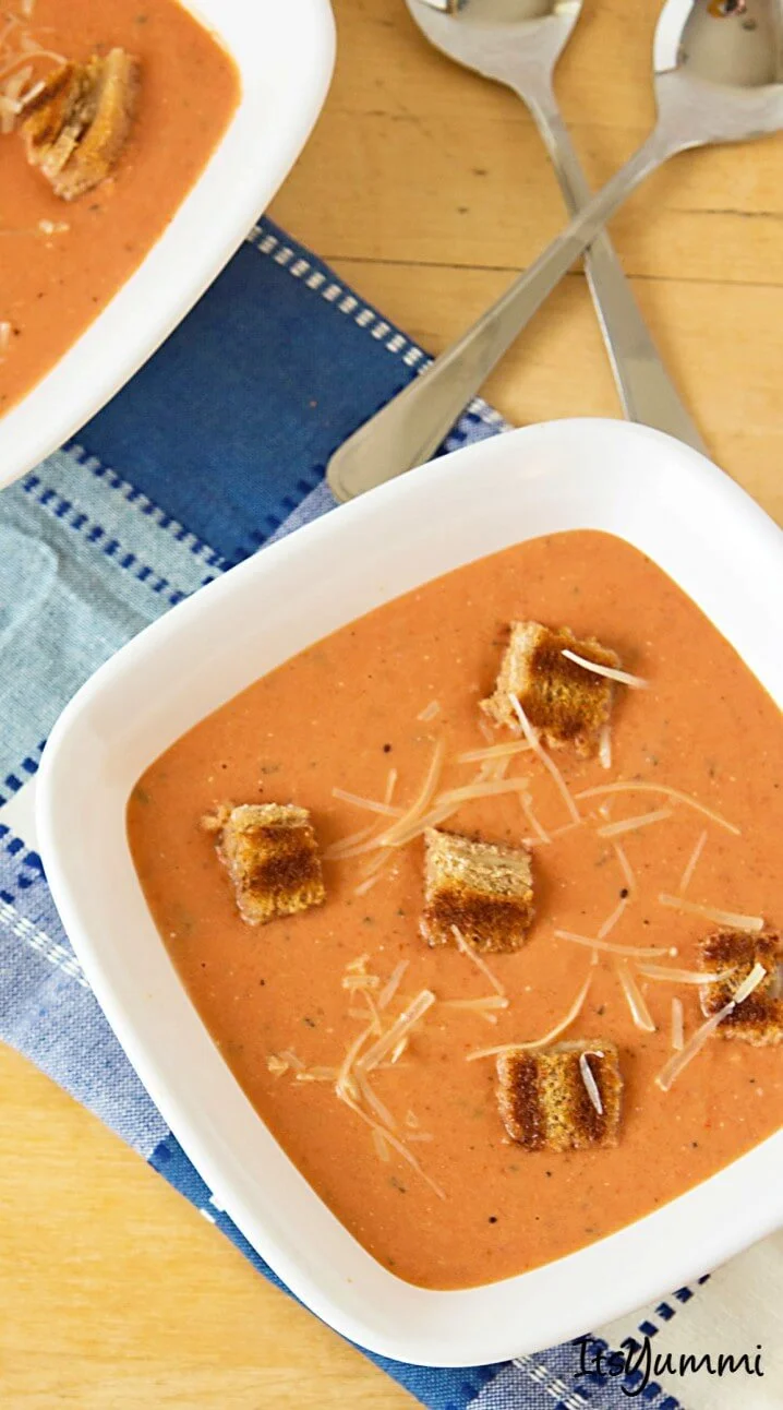 a bowl of Homemade Cream of Tomato Soup garnished with Grilled Cheese Croutons
