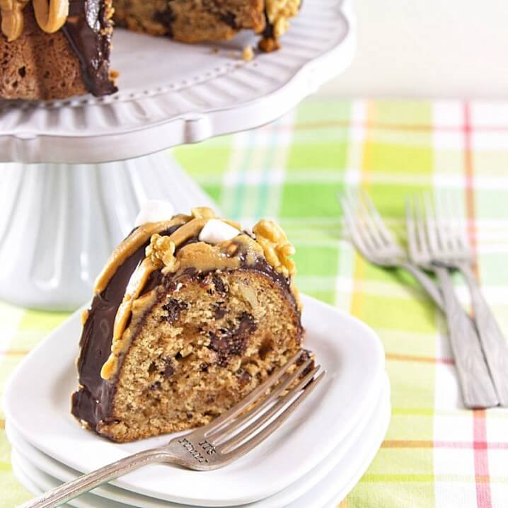 This Elvis on a Rocky Road bundt cake recipe will blow your mind! Peanut butter and bananas are combined with traditional rocky road flavors to create this delicious cake!