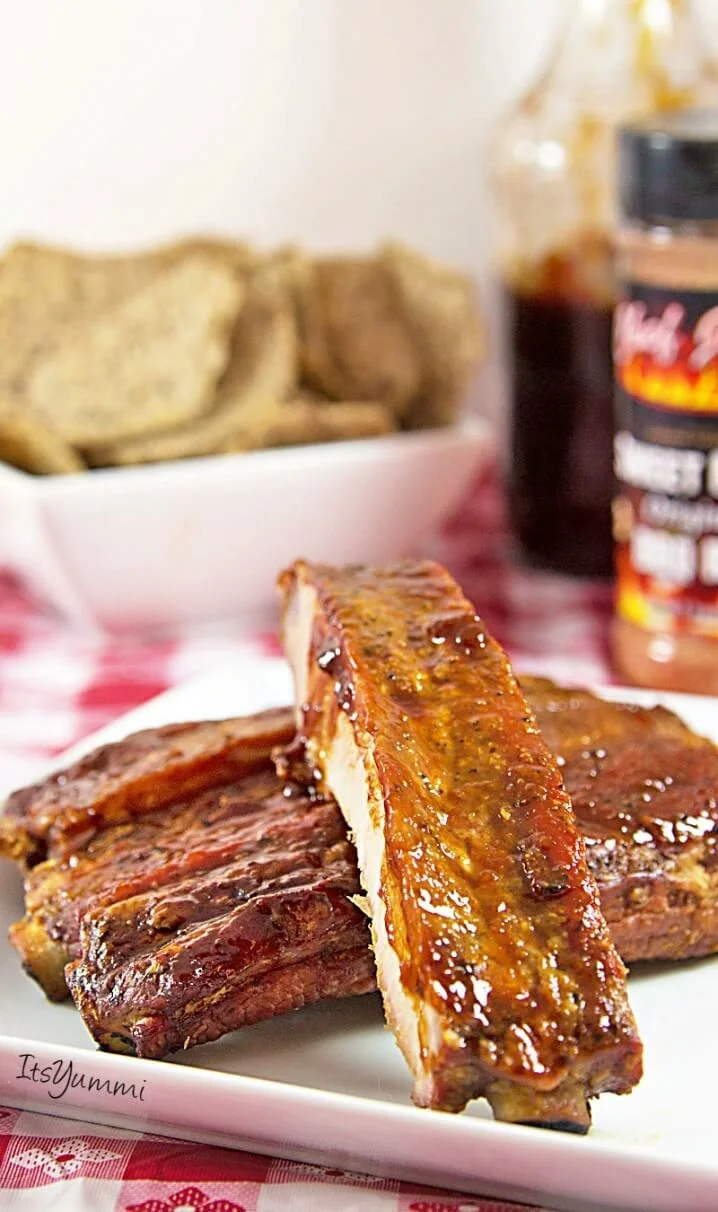 smoked ribs mopped with Louisiana-style BBQ sauce
