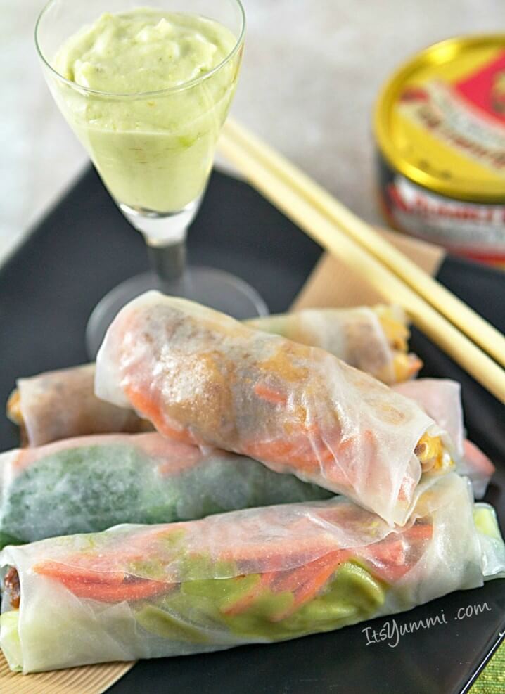 Sundried Tomato Tuna Spring Rolls on a plate with avocado crema dipping sauce