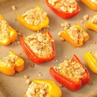 Cheesy Crab Bites Recipe ~ These gluten free, low carb appetizers are packed w/ crab, cream cheese, and bacon, then topped with pork rinds. Get the recipe on ItsYummi.com