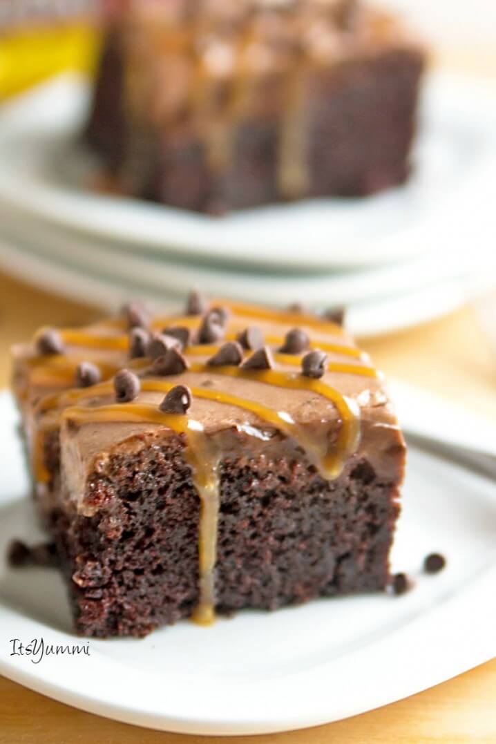 Extreme Chocolate Poke Cake - This dessert has 5 different layers of chocolate in it! Chocolate cake, chocolate pudding, chocolate ganache, chocolate whipped cream, and mini chocolate chips. It's all topped off with a drizzle of caramel, making this an extreme chocolate lover's dessert! Recipe on ItsYummi.com