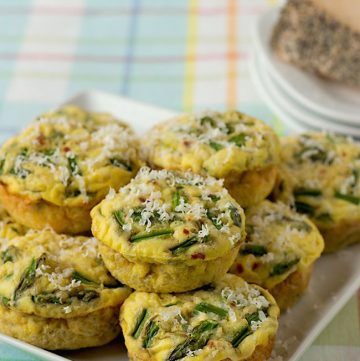 Quinoa quiche muffins with peppered Parmesan cheese and asparagus are fluffy, tender egg muffins. They're delicious for any holiday brunch, or breakfast or lunch on the go. | ItsYummi.com | brunch recipes | gluten free | Sartori cheese | Easter recipes