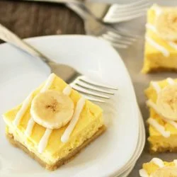 plated dessert - banana cheesecake bars with white chocolate drizzle