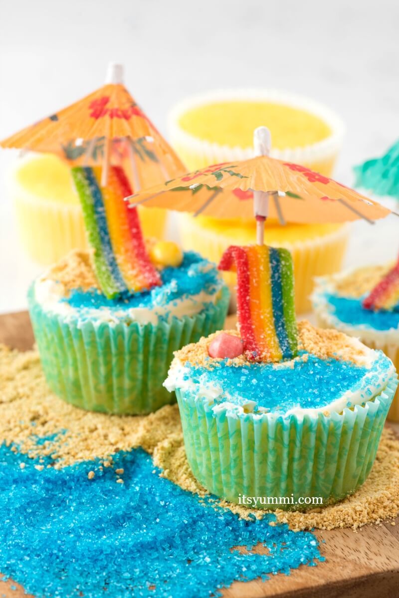 Beach themed cupcakes decorated with candy and colored sugar