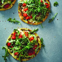 Pesto Flatbread Pizza with Tomato, Arugula, and Mozzarella Cheese