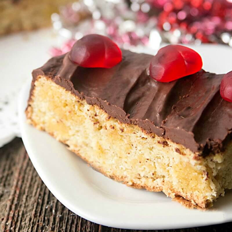 slice of chocolate almond flour cake with low carb chocolate ganache
