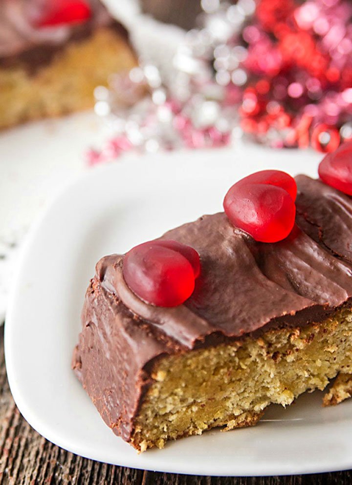 slice of low carb chocolate almond flour cake decorated for Valentine's Day