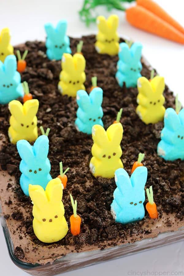 chocolate poke cake decorated with marshmallow Peeps bunnies