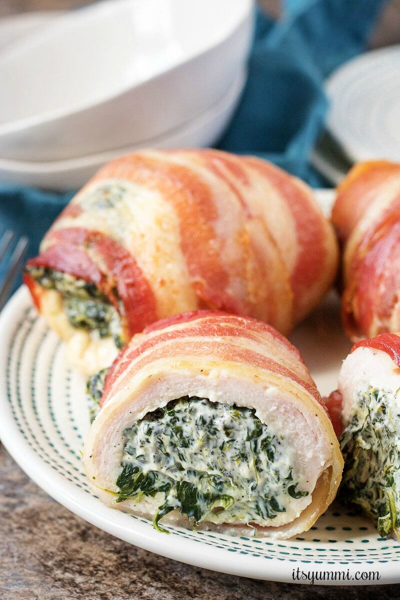 bacon wrapped bundles of chicken breast stuffed with cream cheese and spinach