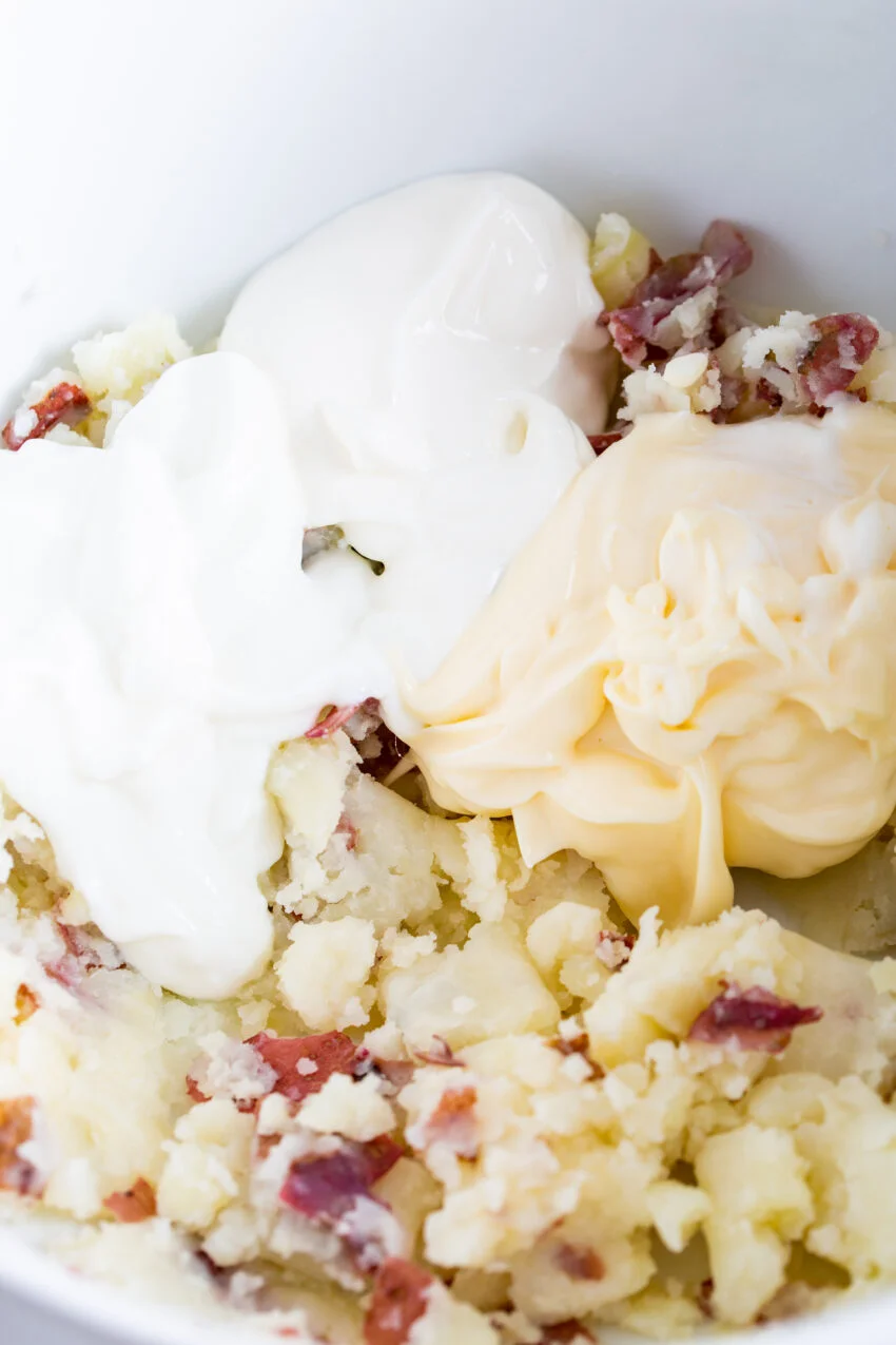 A process shot of potato salad with sour cream, greek yogurt, and mayonnaise