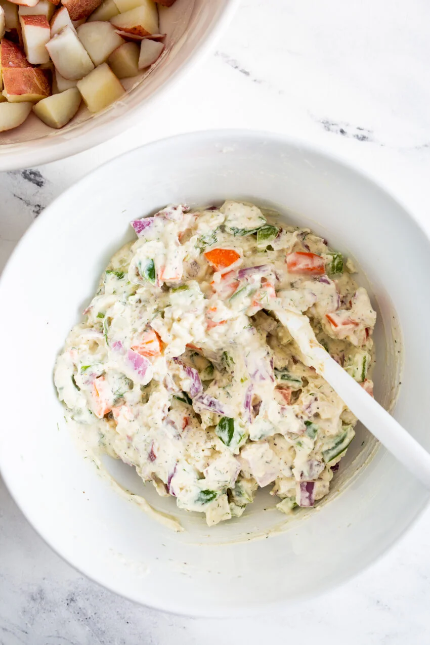 An aerial process shot making potato salad