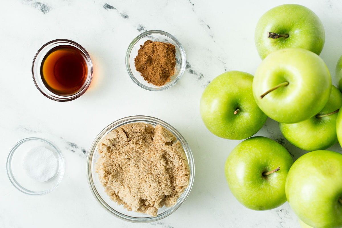 5Ingredients laid out on table that you'll need: Apples, Cinnamon, Sugar Vanilla and salt 