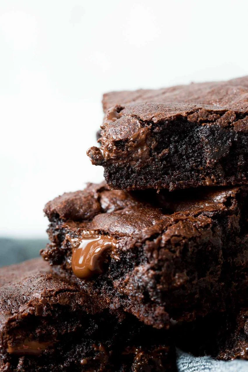 Image of: Stack of three homemade brownies in accending levels.