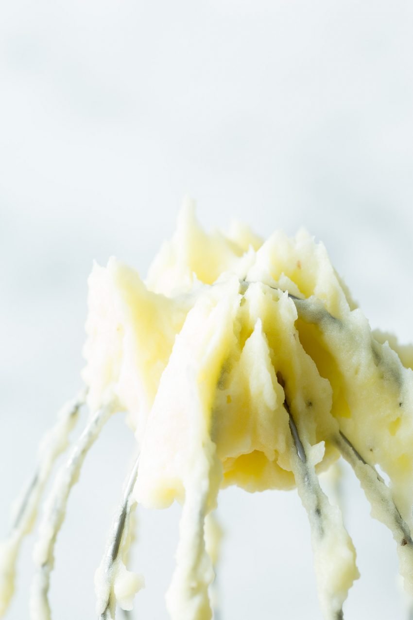 A zoom image of mashed potato on a whisk