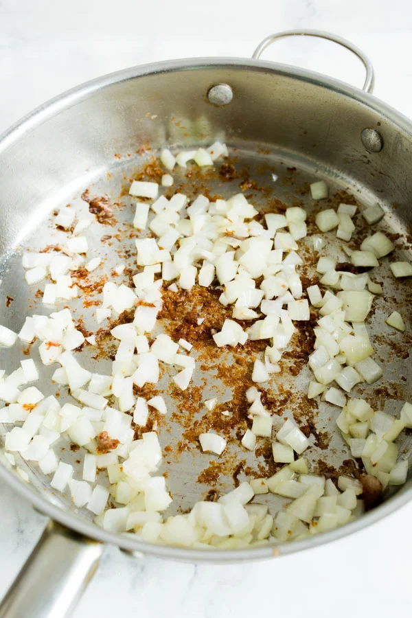A skillet of diced onions